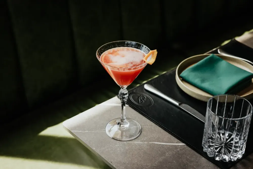 Pink cocktail with lemon garnish — The Junction Stouffville case study
