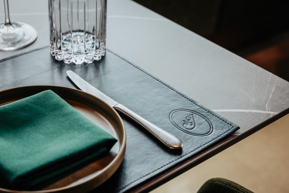 Empty plate with green napkin — The Junction Stouffville case study